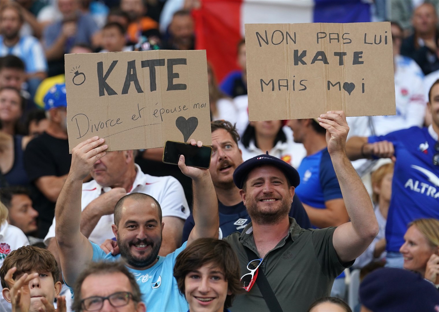 Rugby fans held signs for Kate at the game (David Davies/PA)