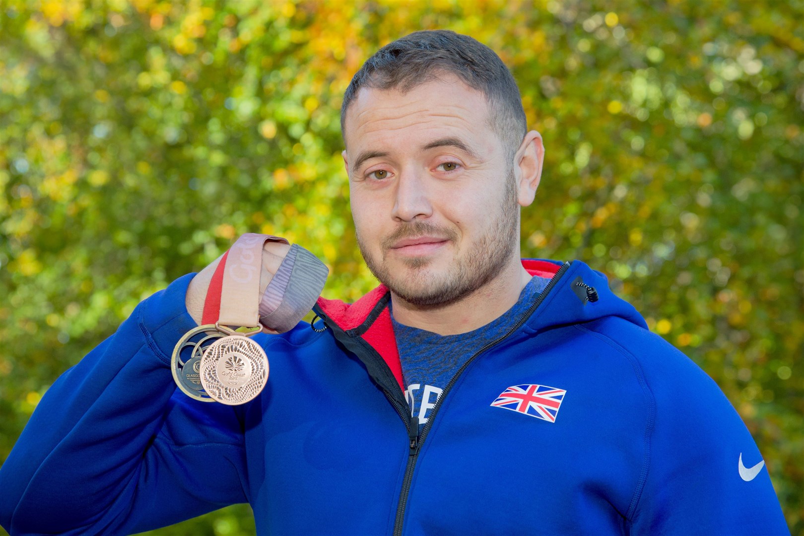 Double Commonwealth Games bronze winner Mark Dry with his medals, just prior to his ban in 2018. Photo: Daniel Forsyth