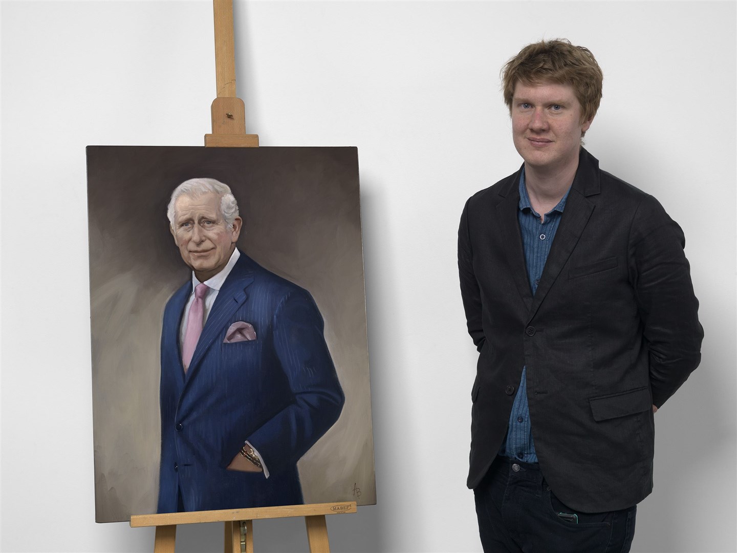 Alastair Barford with his portrait of the King (Alastair Barford/Illustrated London News/PA)