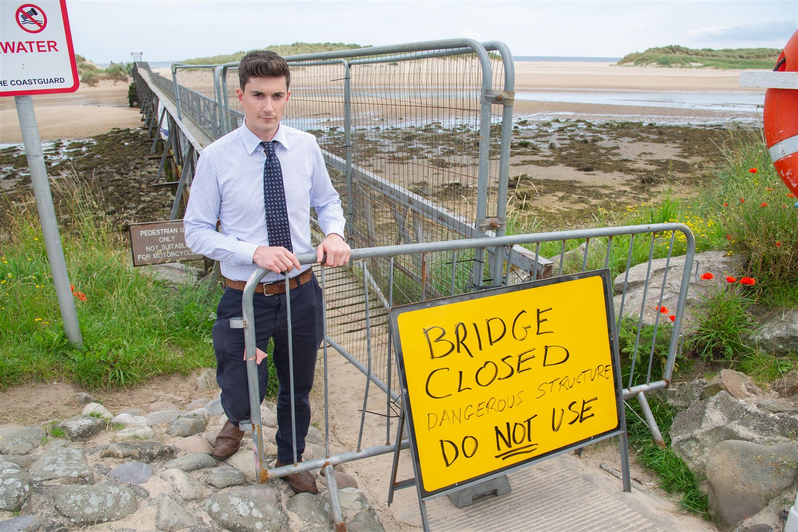Huw Williams, Development Officer of the Lossiemouth Community Trust, at the Lossiemouth East Beach footbridge which has been closed to the public due to safety concerns...Picture: Daniel Forsyth. Image No.044511.