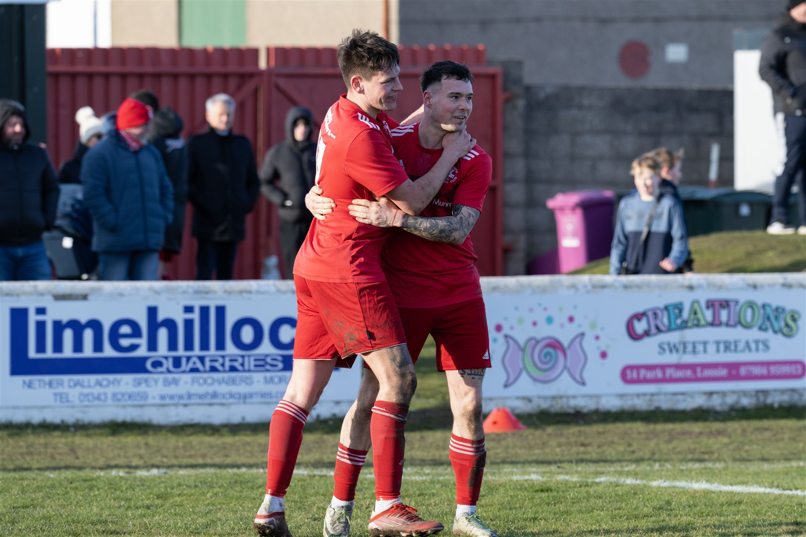 Lossie's Jared Kennedy celebrating with Niall Kennedy after his successful penalty. ..Lossiemouth F.C. v Turriff United F.C. at Grant Park...Picture: Beth Taylor.