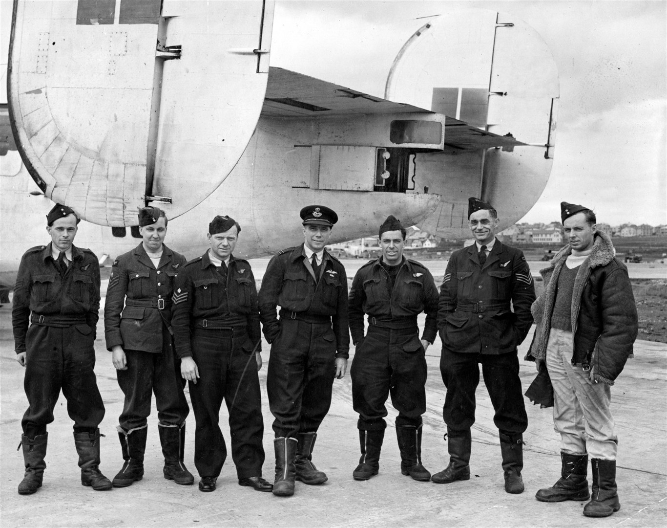 Flight Lieutenant AW Fraser and his crew, stand in front of their Consolidated Liberator I, AM929/H, of 120 Squadron RAF, at Reykjavik, Iceland, after sinking the German type IXD2 submarine U-200 on 24 June 1943. Fraser was awarded a bar to his DFC for attacking the U-boat in the face of determined anti-aircraft fire, and for bringing his damaged aircraft and crew safely back to base following the engagement. Left to right: Sergeant AW Parsons (flight engineer), Flight-Sergeant K Johnson (wireless oeprator/air gunner), Flight-Sergeant W Stott (wireless operator/air gunner), Flight Lieutenant AW Fraser (pilot), Flight-Sergeant LC Heiser (nvaigator), Flight-Sergeant EA Mincham (wireless operator/air gunner), and Sergeant HJ Oliver (2nd pilot). Picture: Air Historical Branch