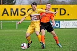 Graeme Grant (left) in action for Forres Mechanics against Rothes.