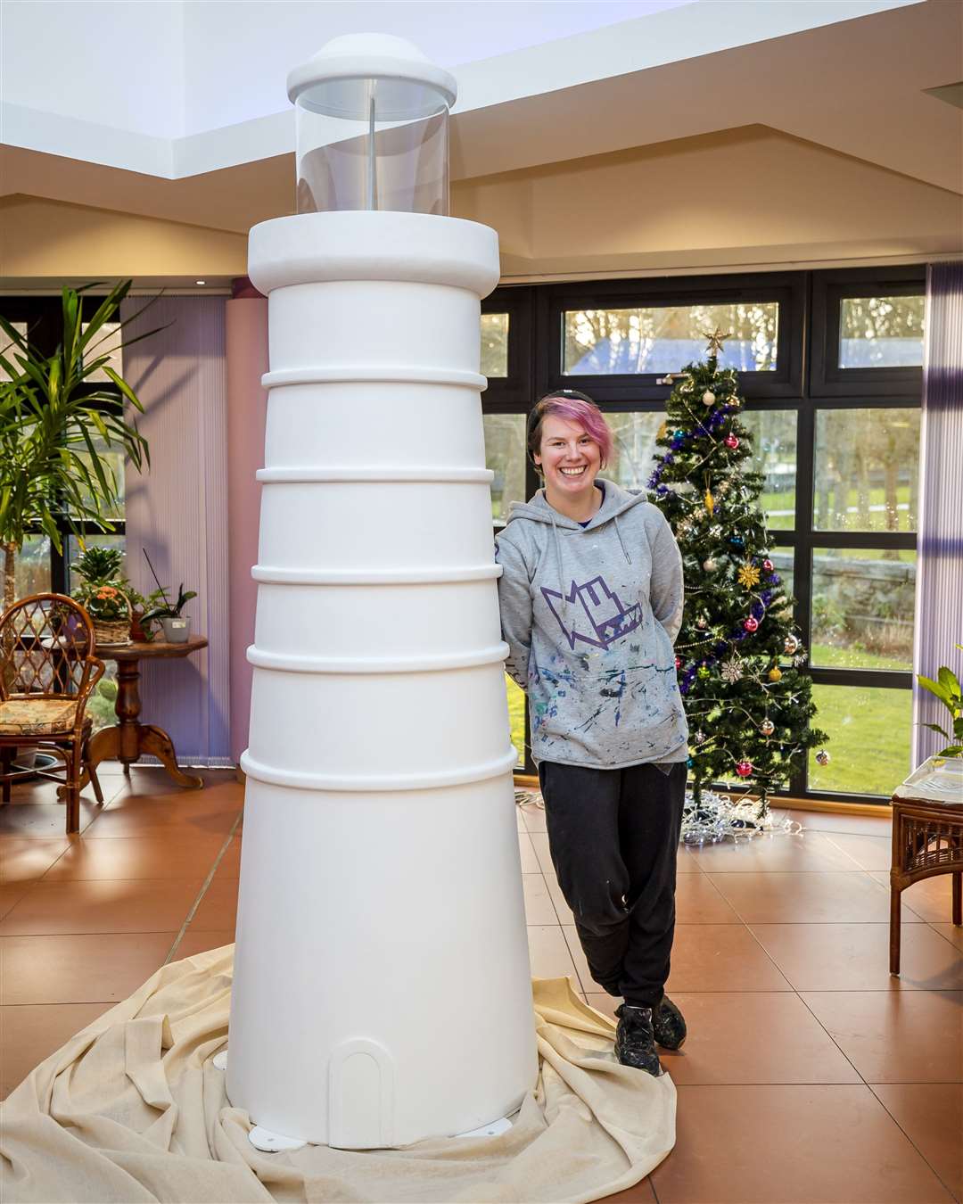 Katie Guthrie from CLAN with one of the lighthouses