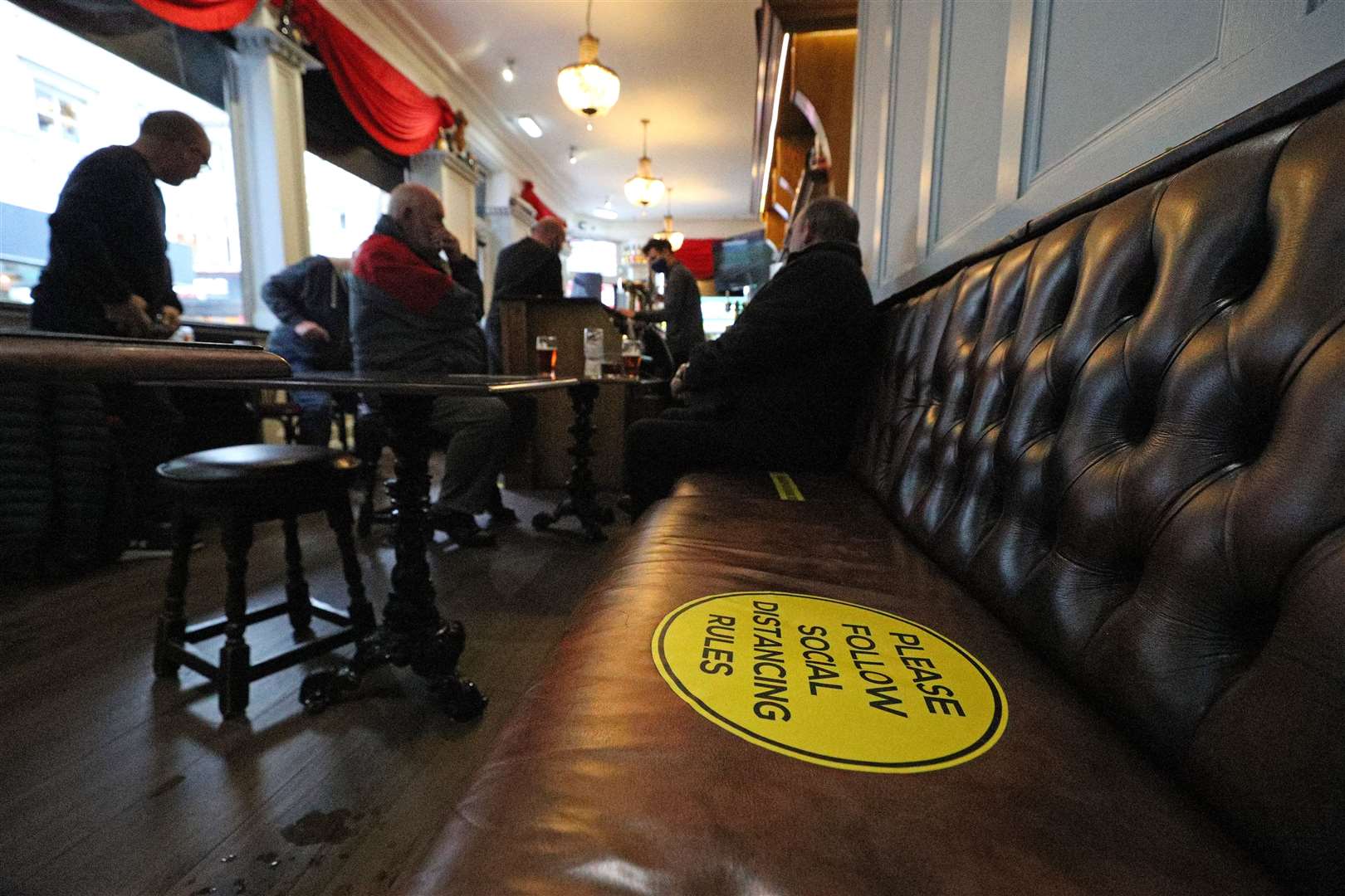 Social distancing in a pub in Liverpool (Peter Byrne/PA)