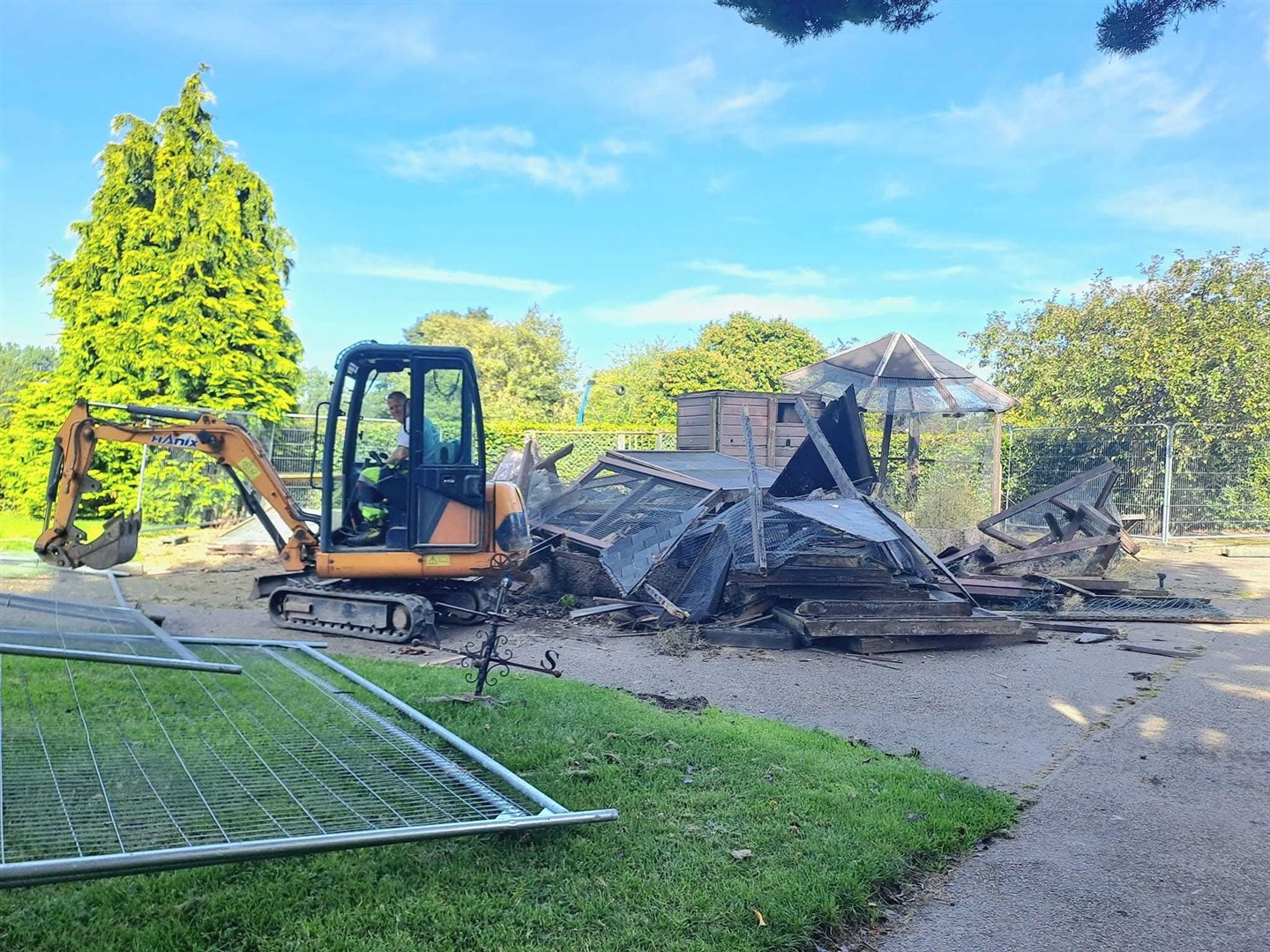 A picture taken by local mum Claire Howie of the aviary being demolished on Wednesday.