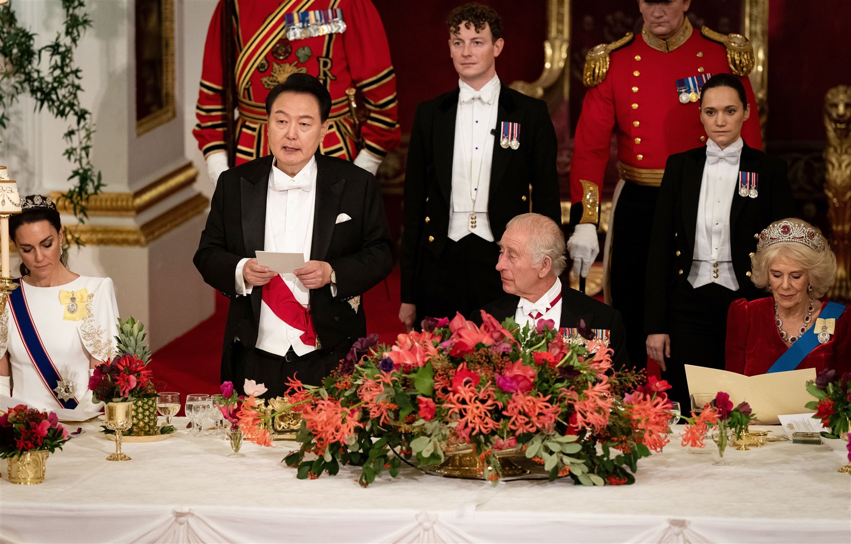 The King, the president and other guests at the top of the table used the coronation glasses updated with the King’s cypher (Aaron Chown/PA)