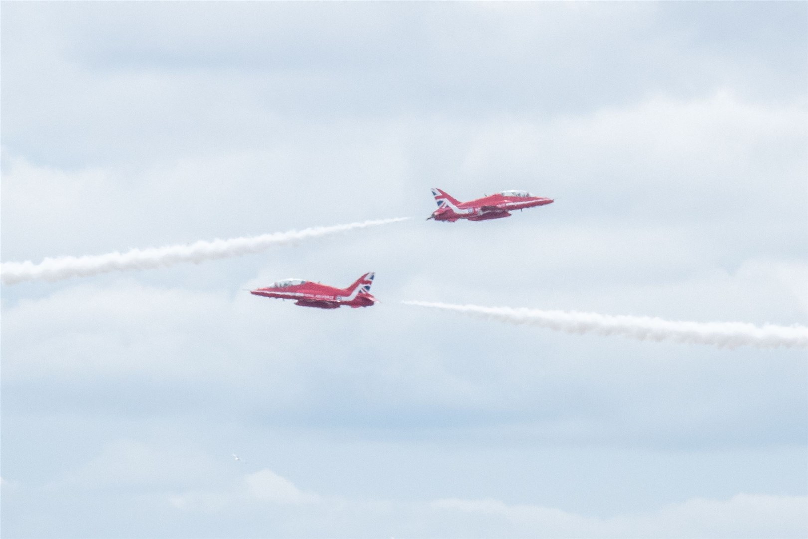 The Red Arrow Display team fly over Lossiemouth as part of the RAF Lossiemouth Family and Friend's Day...Picture: Daniel Forsyth..