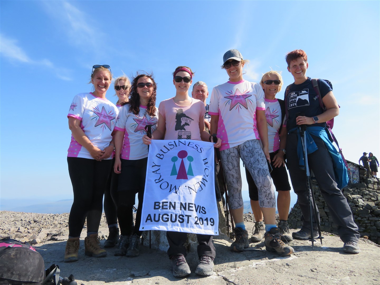 At the summit of Ben Nevis are (from left) Bev Alexander, Caroline Byrne, Claire Ironside, Amy Dee, Ailsa Stinson, Lisa Esslemont and Clare Locke joined by Clare’s husband Steve.