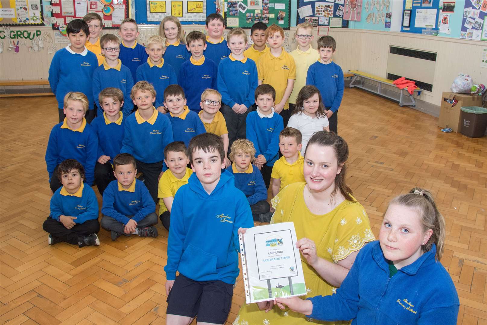 Front from left, Ethan Butchart, teacher Rebecca Thoms and Kayla Ewen. The Eco Group at Aberlour Primary School helped the town earn Fairtrade status.