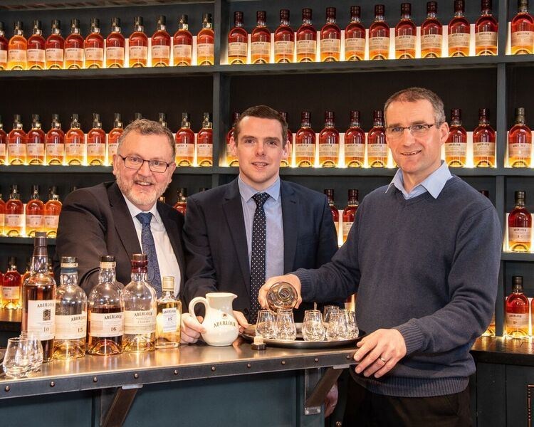 Douglas Ross, centre, with David Mundell, left, at Aberlour Distillery.