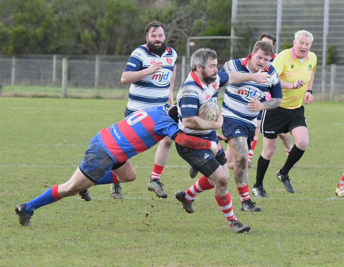 Chris Robottom gets tackled. In the background are Daniel Davidson and Fraser Ireland. Picture: James Officer