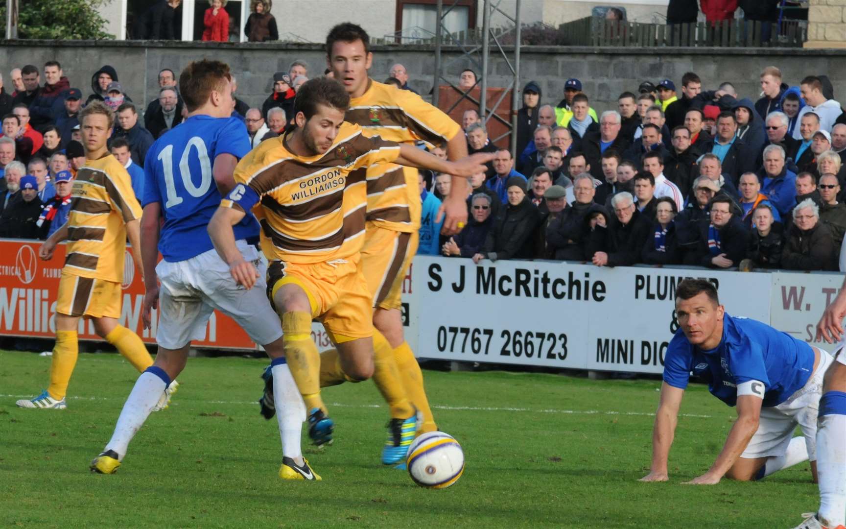Ross Macpherson is brought down while skippering Forres in Scottish Cup action against Rangers in October 2012.