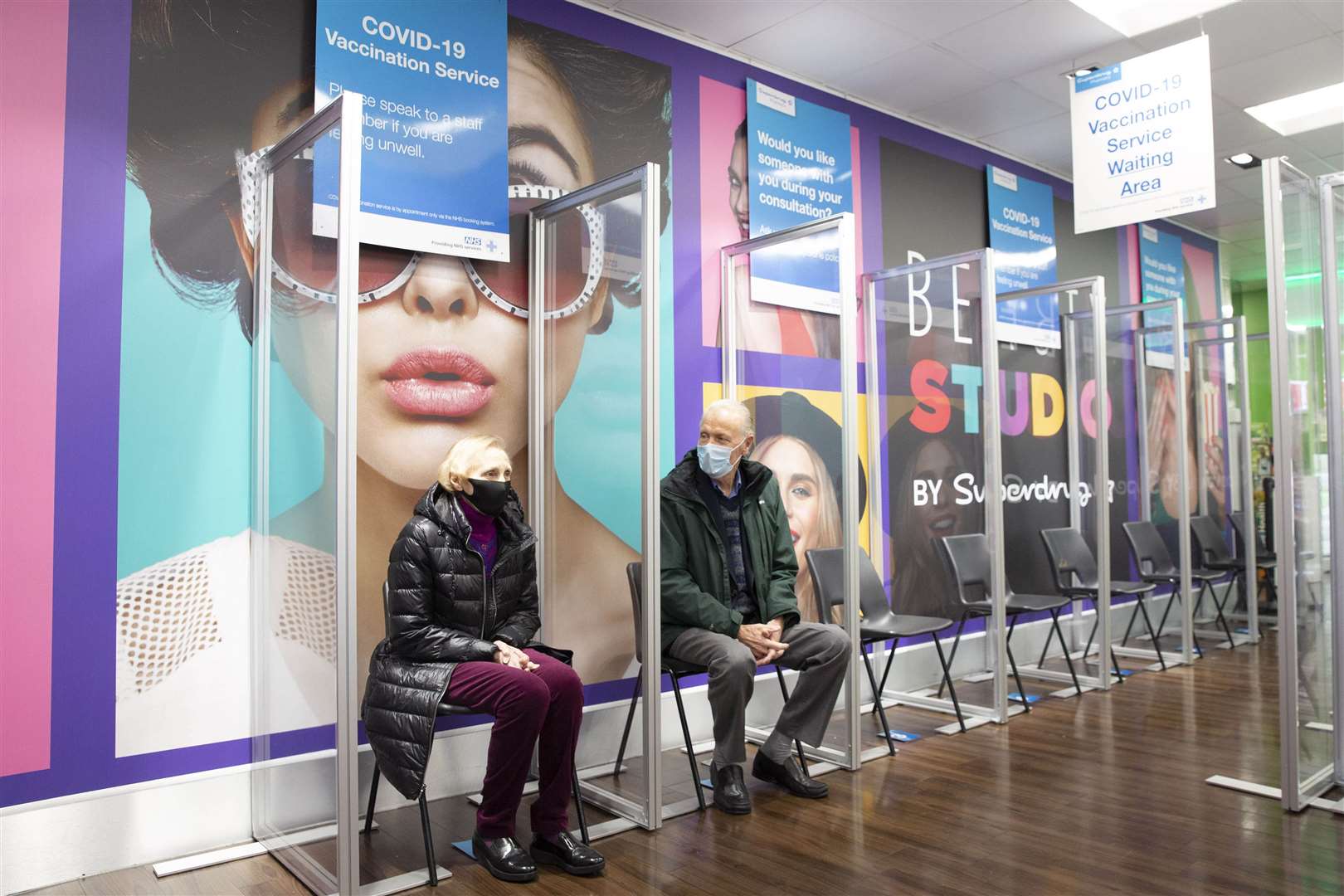 Patients wait to receive the AstraZeneca/Oxford Covid-19 vaccine at Superdrug in Guildford (Matt Alexander/PA)