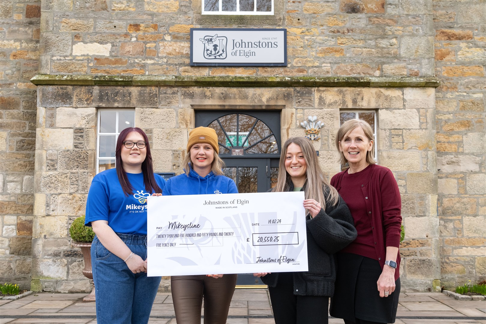 From left: Chloe O'Connor (Fundraising and Events Coordinator), Allana Stables (Bee the Change Manager) from Mikeysline with Darcie Stevenson (User Experience Coordinator) and Julia McGlashan (People Director) from Johnstons of Elgin. ..Johnstons of Elgin Charity Fundraising hands over a cheque for Â£20,550.25 to Mikeysline. ..Picture: Beth Taylor.
