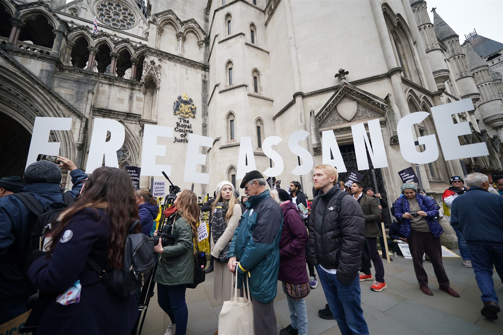Supporters outside the Royal Courts of Justice in London, during the two-day hearing in the extradition case of WikiLeaks founder Julian Assange (Yui Mok/PA)