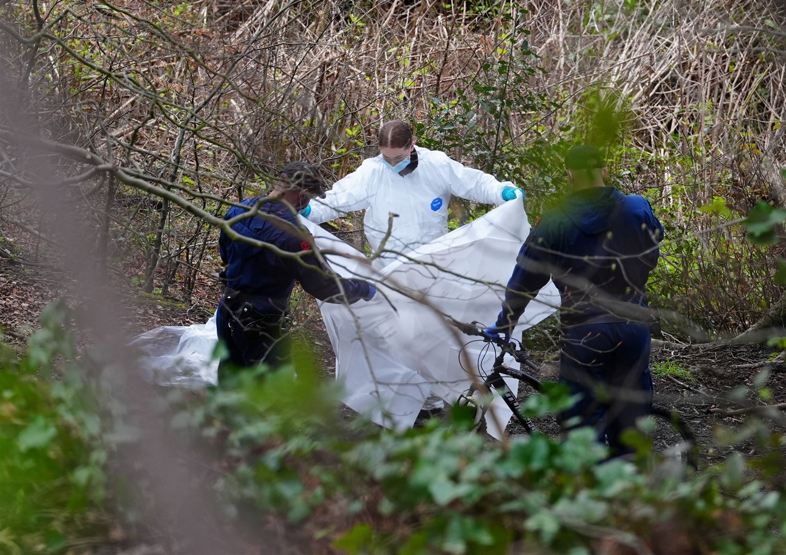 Police and forensic officers at Kersal Dale, near Salford, after human remains were found (Peter Byrne/PA)