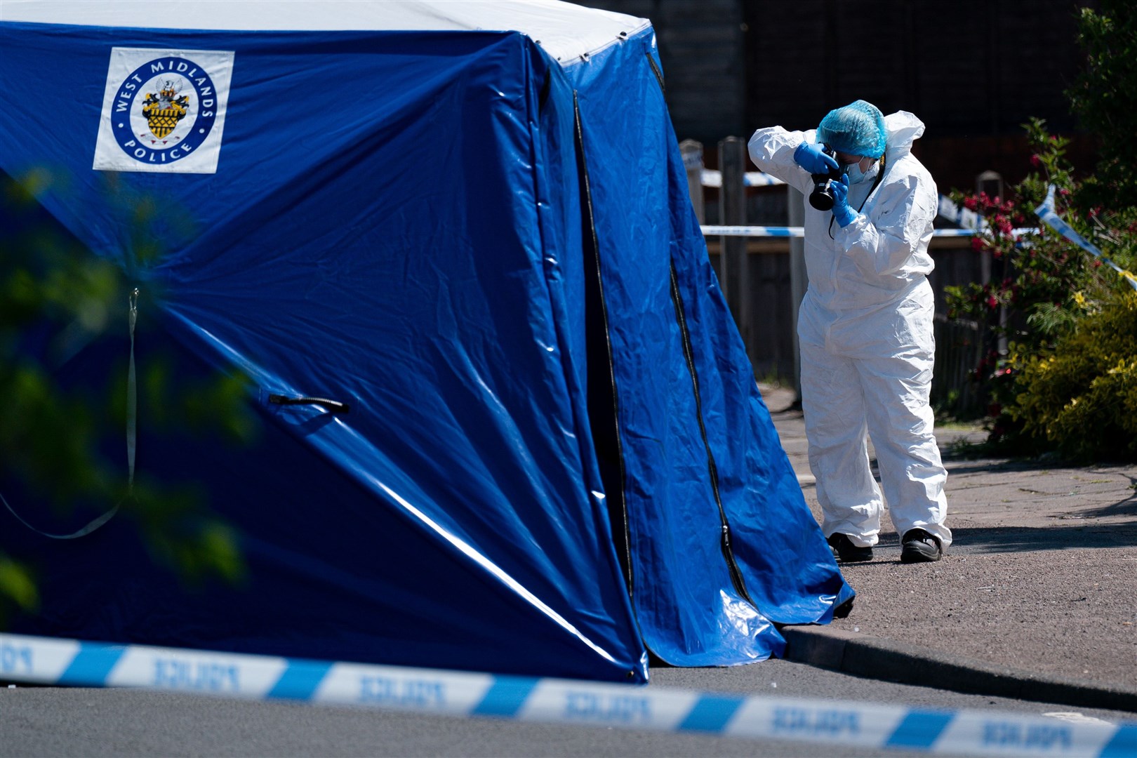 A forensics officer at the scene on College Road, Kingstanding, last year (Jacob King/PA)