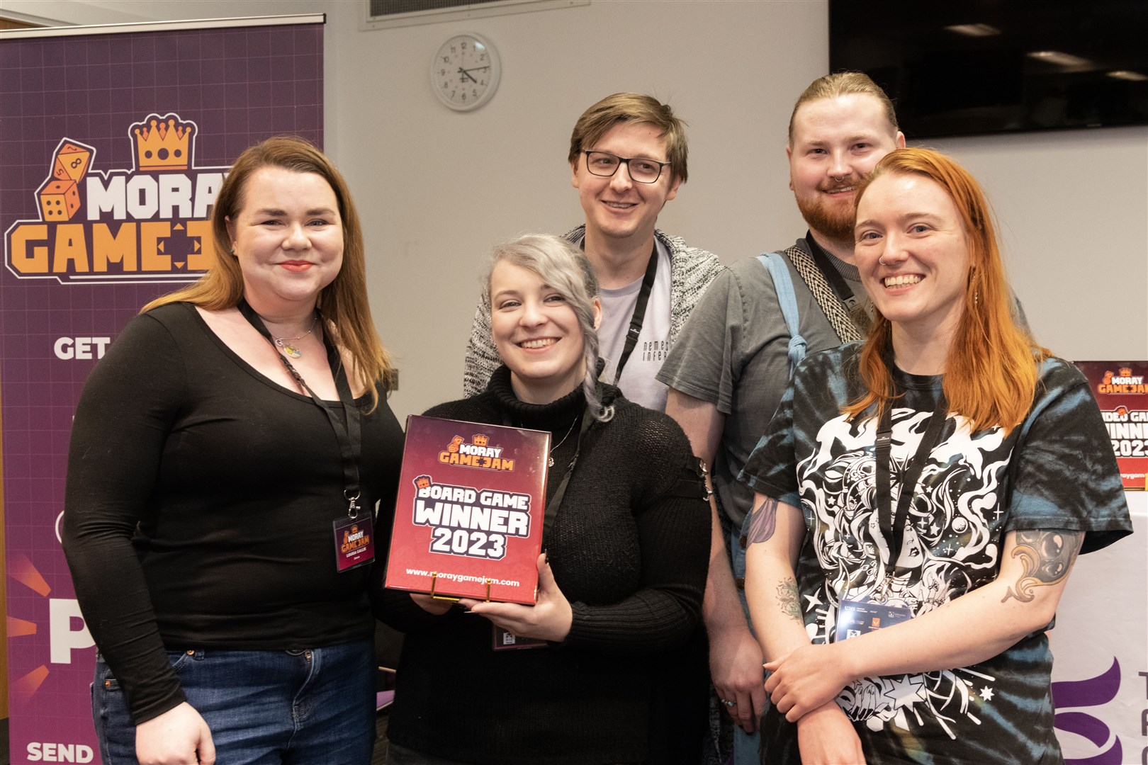 From left: Louisa Gallie presents Cari Watterton, Scott Simpson, Alex Murray and Erin Stevenson with the Board Game Winner trophy with their game, The Monster after Midnight. Picture: Beth Taylor