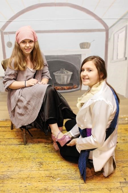 Portsoy Players’ pantomime stars Iona Rayne as Prince Charming, seen here trying the glass slipper on Cinderella, played by Abbey Mcleay.