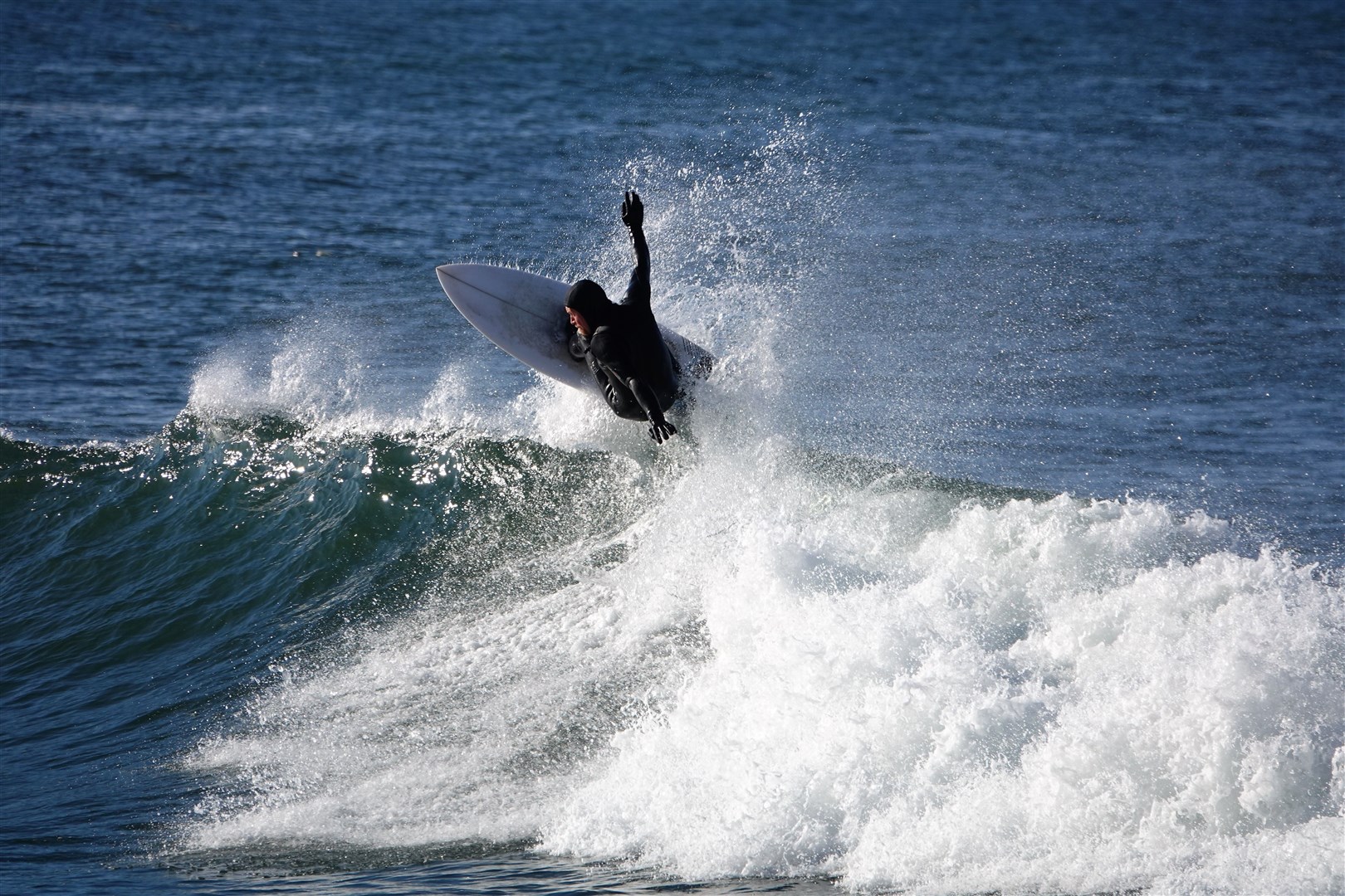 Donald Peace of New Waves Surf School having fun at Hopeman in the October sun. Picture: Dode Fraser