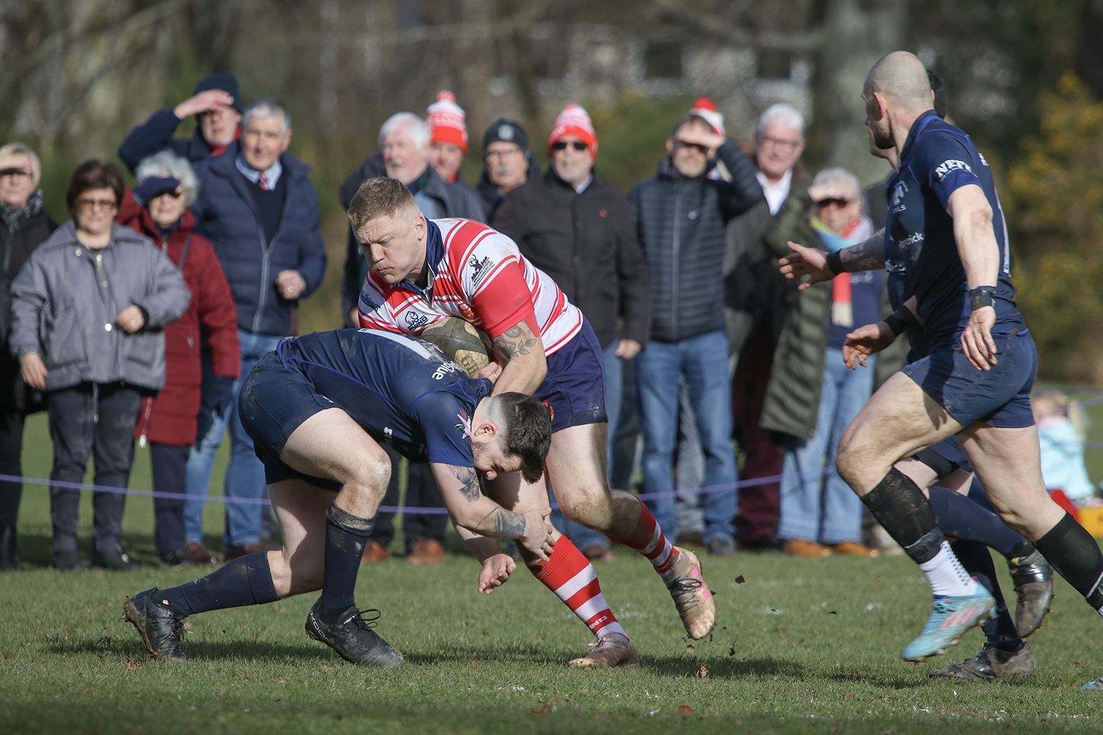 Lewis Scott drives through a Lossie tackler. Picture: John MacGregor