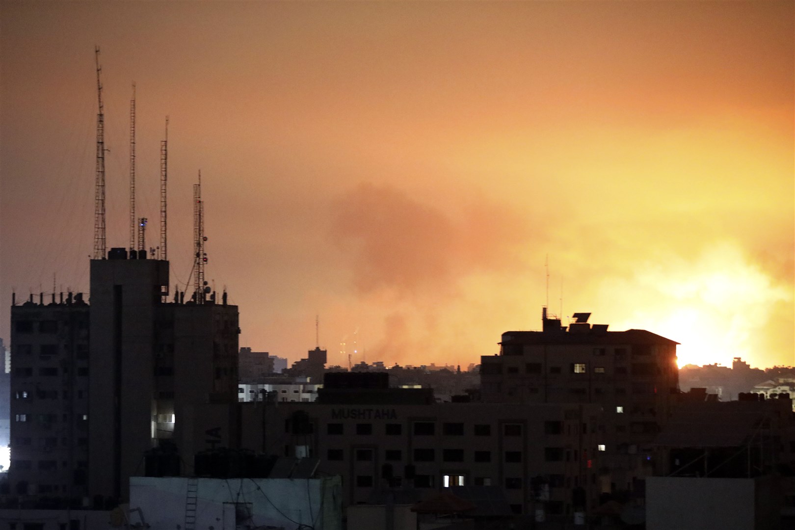 Explosions caused by Israeli air strikes have rocked the northern Gaza Strip (Abed Khaled/AP)