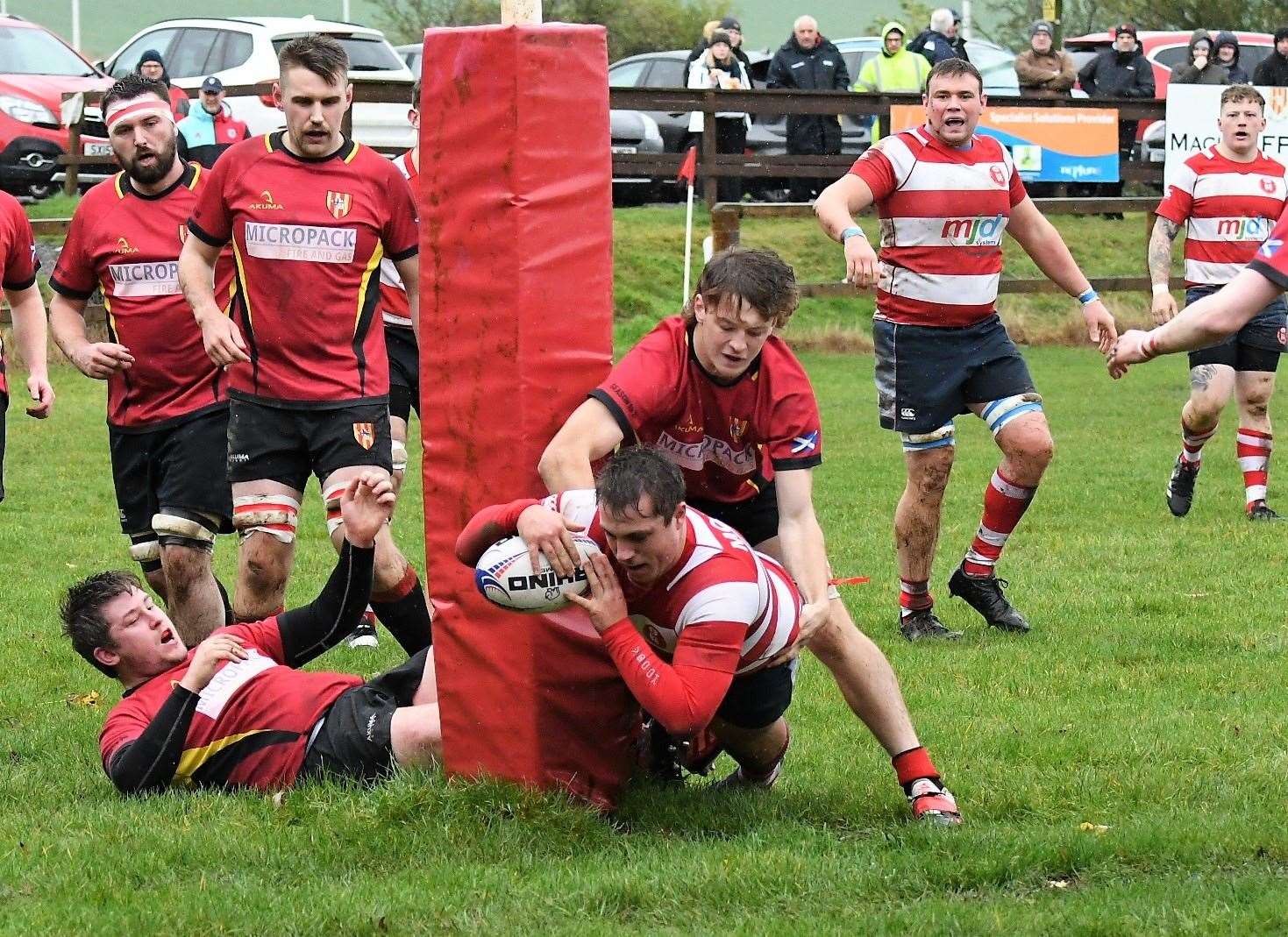 Cameron Hughes breaks tackle to score first try. In background is Steven Clark and Lewis Scott. Photo: James Officer
