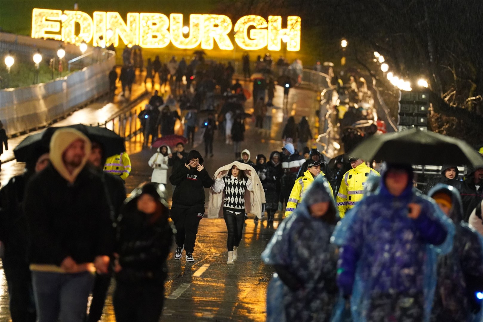 Revellers gather in Princes Street for the Hogmanay celebrations (Andrew Milligan/PA)