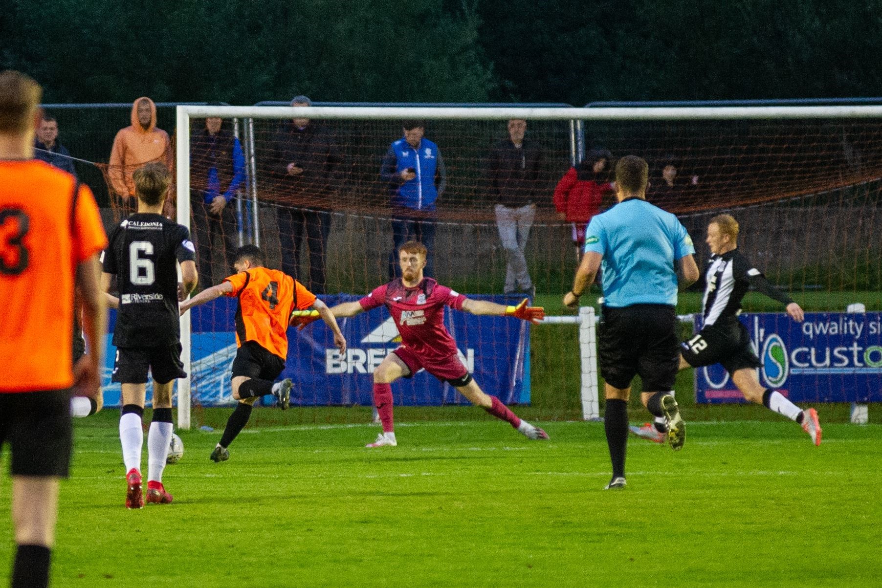 Jack Brown is away to score his second Rothes goal of the evening past Elgin keeper Tom McHale. Picture: Daniel Forsyth....