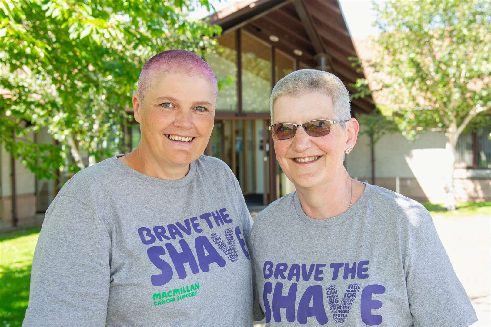 All smiles after raising more than £4300 by braving the shave for Macmillan Cancer Support are Margaret-Ann Mitchell (left) and Joyce Geddes. Picture: Daniel Forsyth. Image No.044538.
