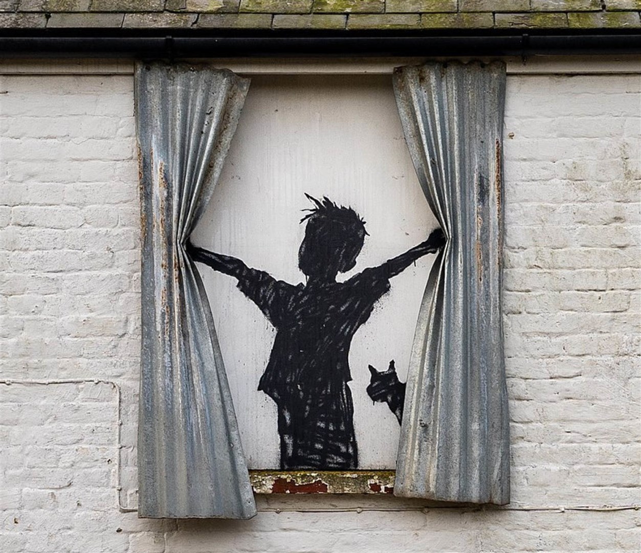 The artwork had corrugated iron curtains (Banksy/Instagram)