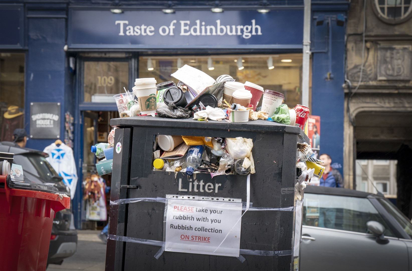 Bins and litter along the Canongate in Edinburgh city centre (Jane Barlow/PA)