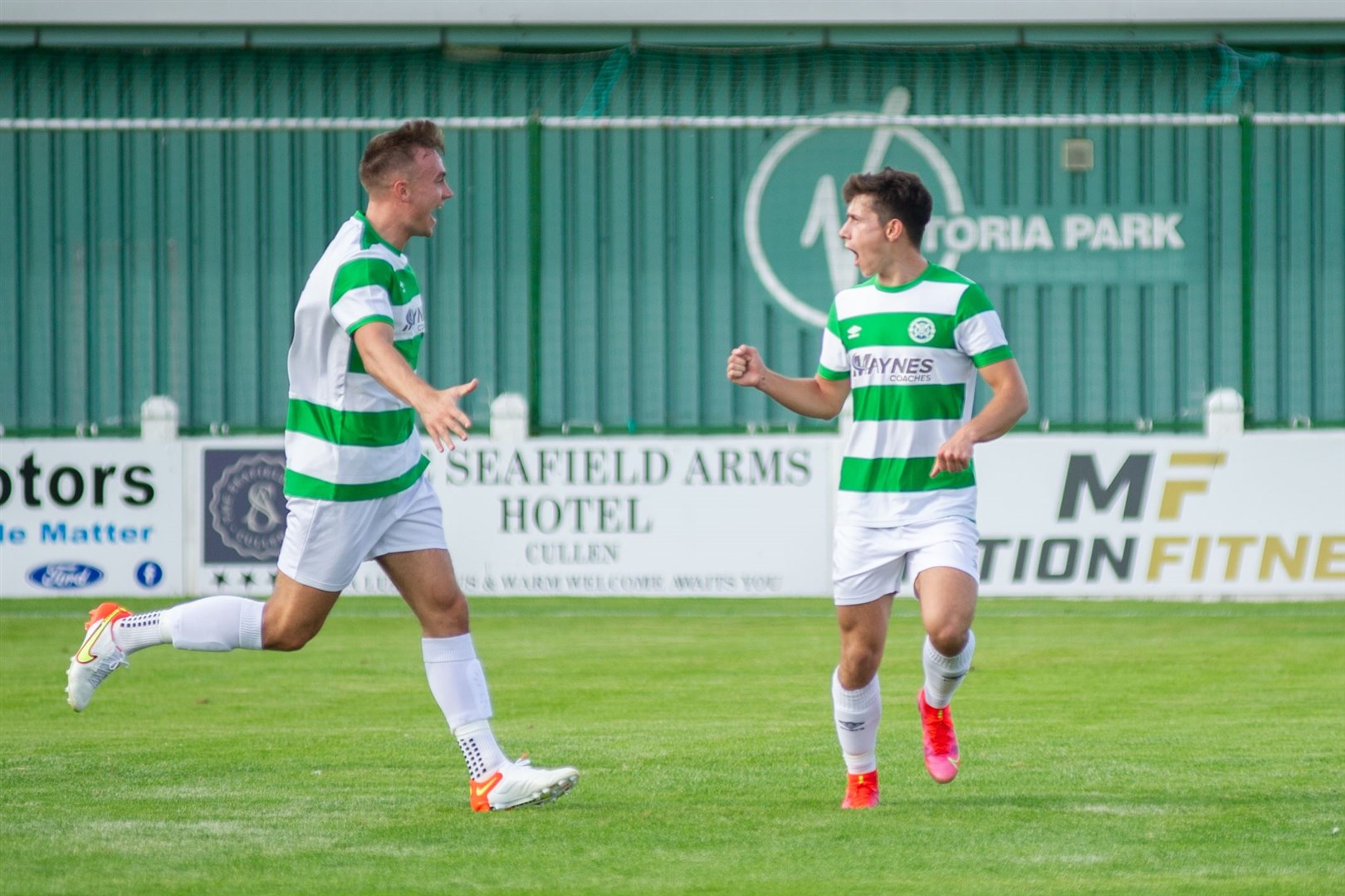 Jags goalscorer Max Barry (right) celebrates after scoring the opening goal with team mate Sam Pugh (left)...Buckie Thistle FC (4) vs Cumbernauld Colts FC (1) - Scottish Cup Round One replay - Victoria Park, Buckie 25/08/2021...Picture: Daniel Forsyth..