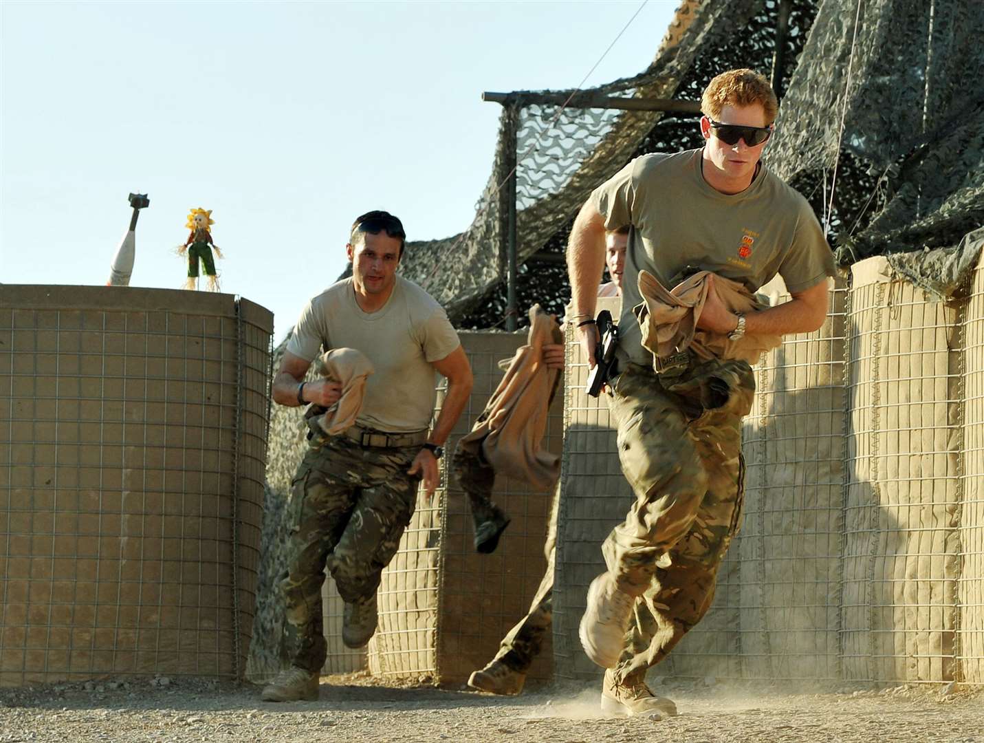 Prince Harry races out from the VHR tent to scramble his Apache at Camp Bastion, southern Afghanistan in 2012 (John Stillwell/PA)