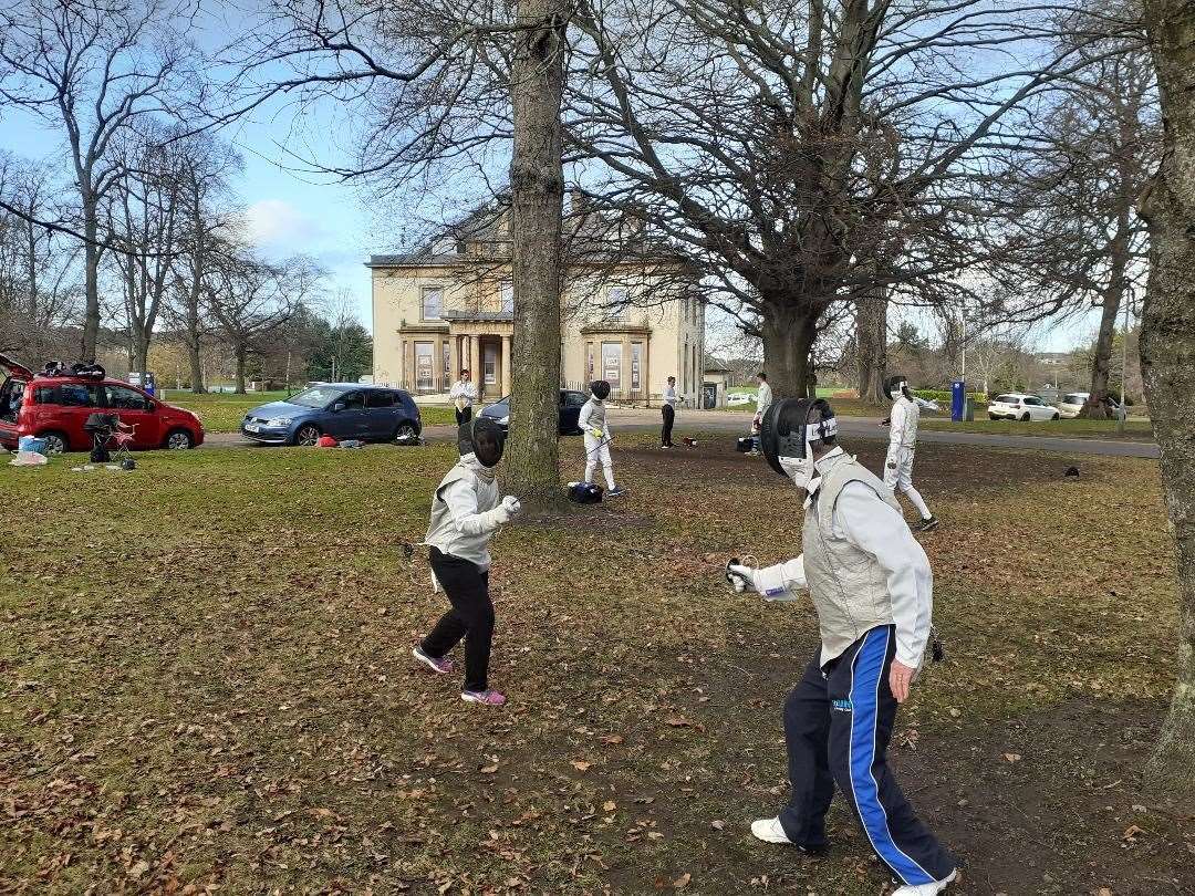 Elgin Duellist Fencing Club in action outdoors at Cooper Park.