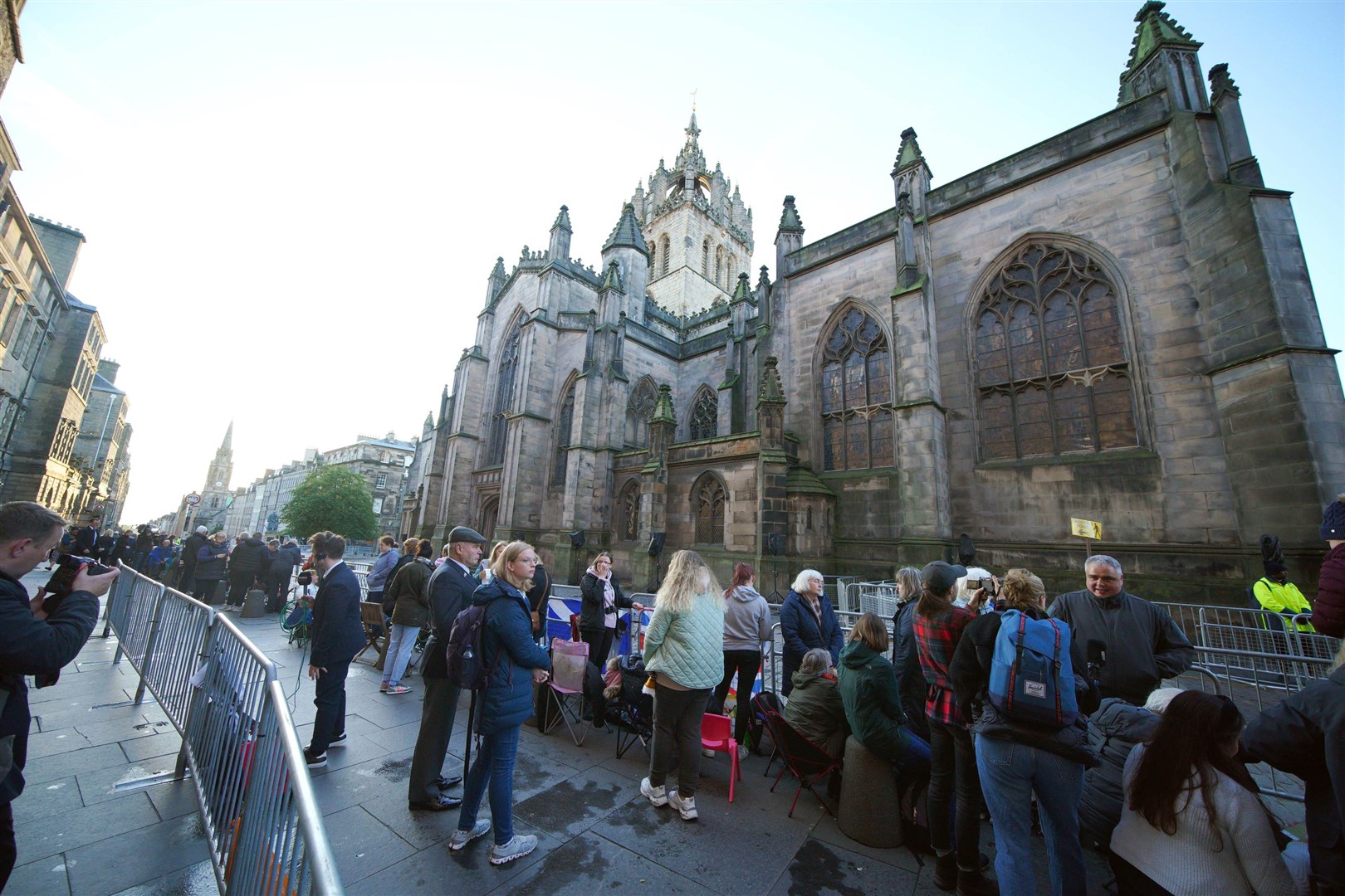 People gather outside St Giles’ Cathedral in Edinburgh ahead of the Procession of Queen Elizabeth’s coffin from the Palace of Holyroodhouse to the cathedral (Peter Byrne/PA)