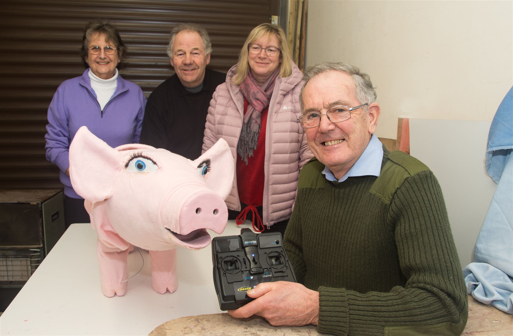 Eddie Pratt (right) has made an electronic pig for Elgin Musical Theatre's upcoming show Betty Blue Eyes. Also pictured (from left) are his wife Jacky, plus Ian Duncan from the society and his wife Beryl who's directing the production. Picture: Becky Saunderson.