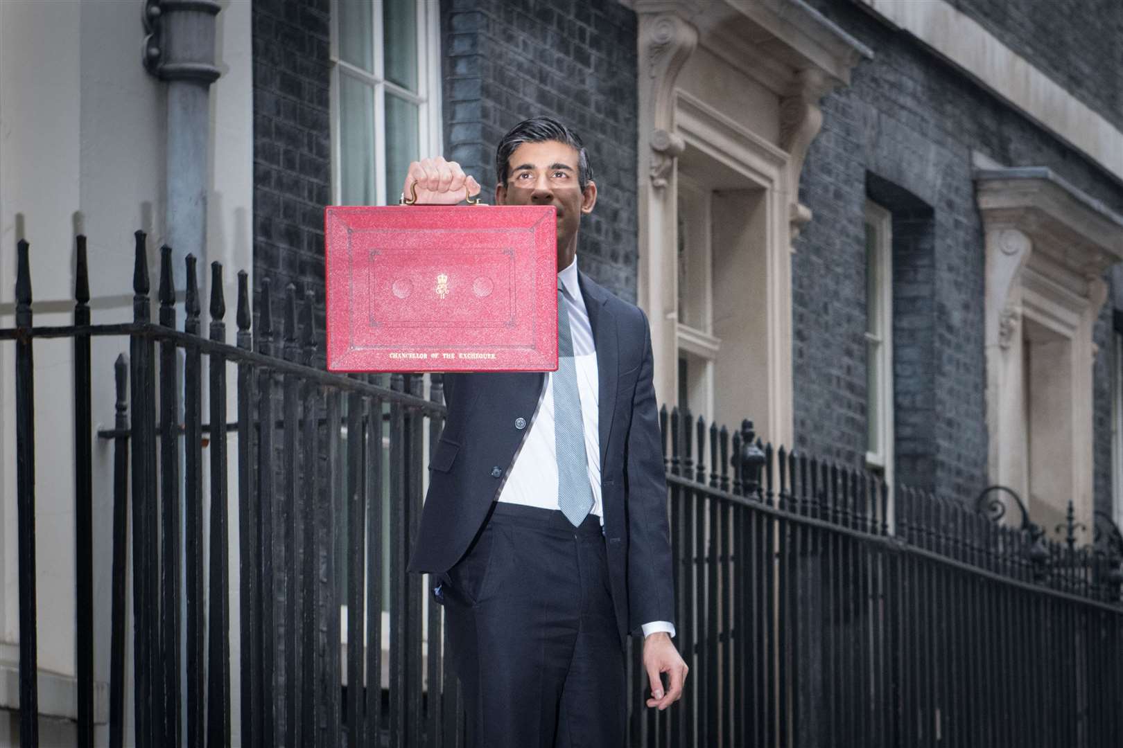 Chancellor of the Exchequer, Rishi Sunak outside 11 Downing Street, London, before heading to the House of Commons to deliver his Budget in March (PA)