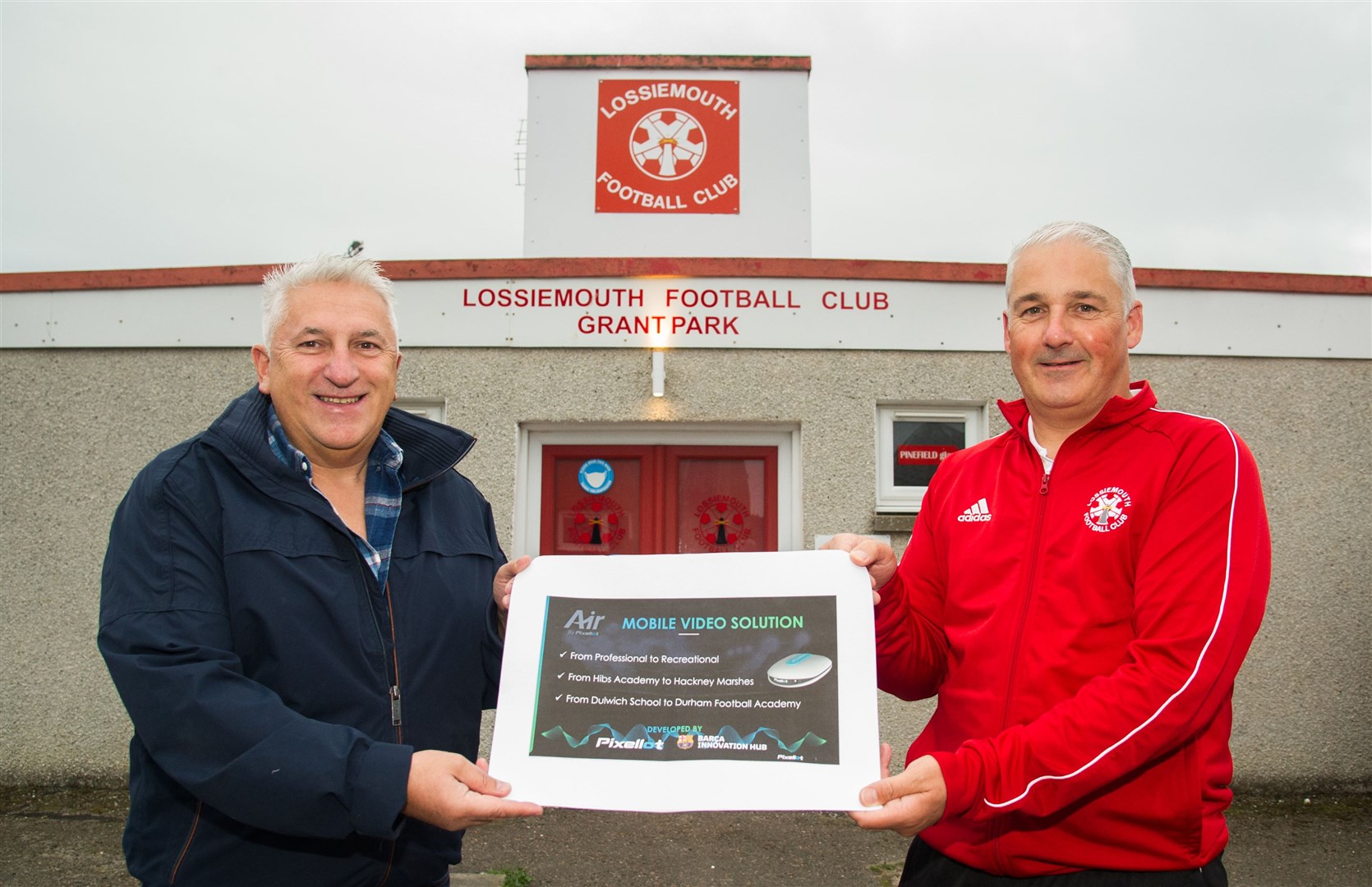 Moray fire safety businessman George Sewell presents Lossiemouth manager Joe Russell with a new Pixelott camera system which will be used for games and training to help the coaching staff. Picture: Becky Saunderson..