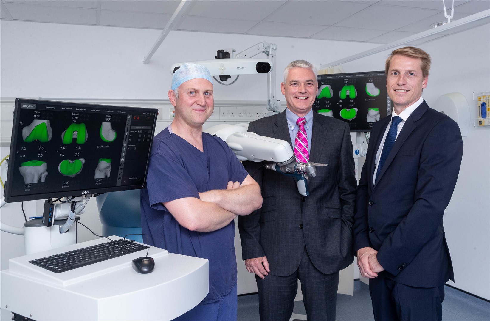 Consultants Steve Hamilton, Robert Duthie and Martin Mitchell with the Stryker Mako robotic arm