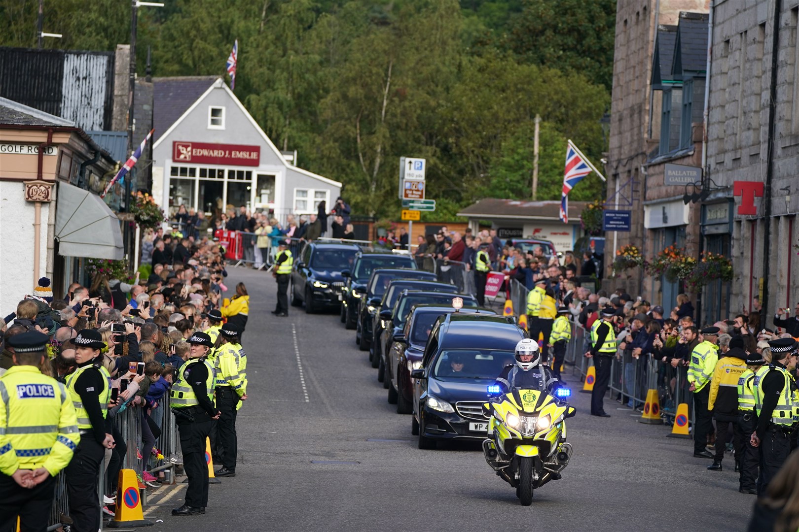 The procession passing through Ballater (Andrew Milligan/PA)