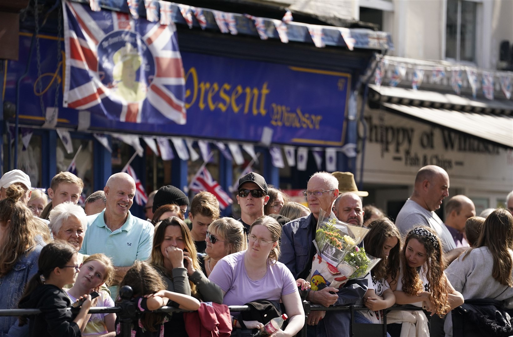 People line the High Street in Windsor ahead of an accession proclamation ceremony at Windsor Castle (Andrew Matthews/PA)