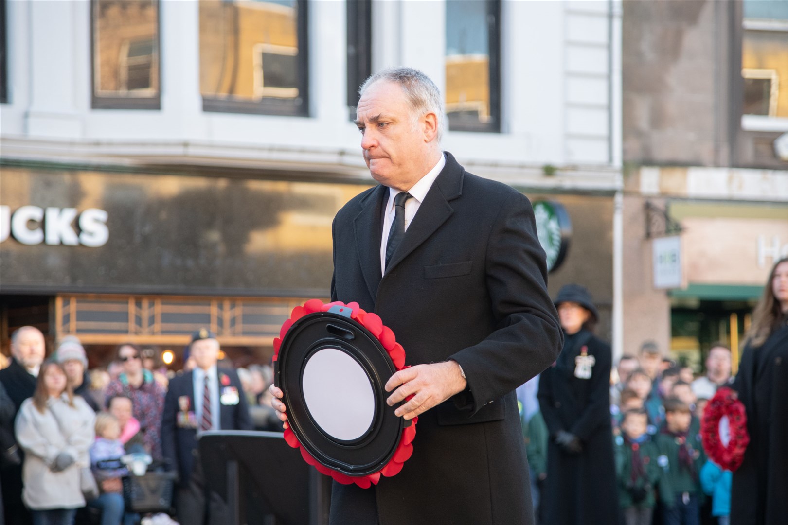 Moray MSP Richard Lochhead...Remembrance Sunday parade and wreath laying on Elgin High Street 2023. ..Picture: Daniel Forsyth..
