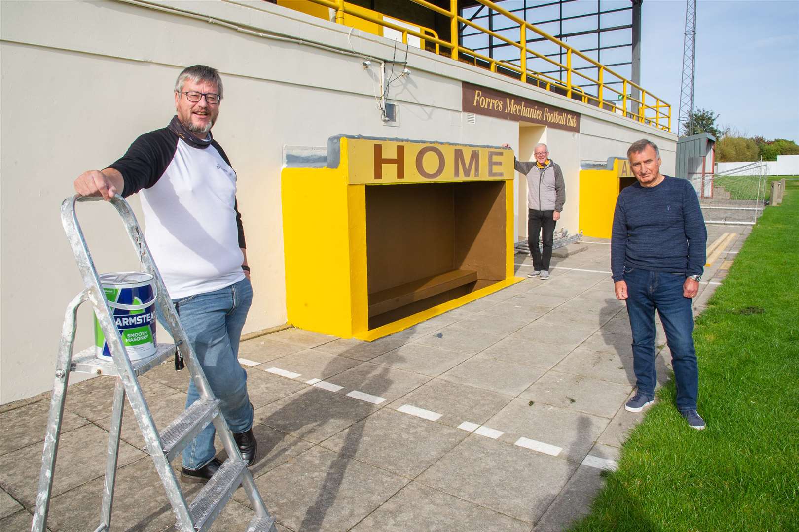 Sandy Wilkie (left) has donated £3250 to Forres Mechanics for paint work to be done around the ground. He is joined by Forres Mechanics financial director Sandy Aird and chairman Dave MacDonald. Picture: Daniel Forsyth