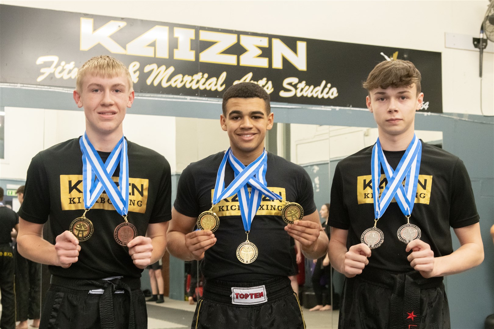 From left: Ross Sharp, Ethan Hendry and Logan Souter from Kaizen Kickboxing have won medals at their recent competition in Paisley...Pictures: Beth Taylor.